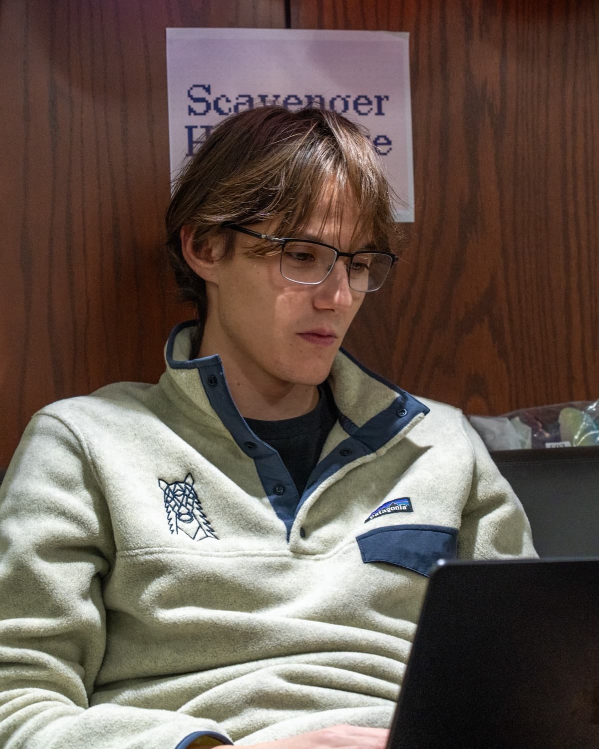 Lucian at Hack Western, laptop open